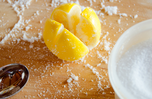 Sprinkle kosher salt in the cuts you have made in the lemons.