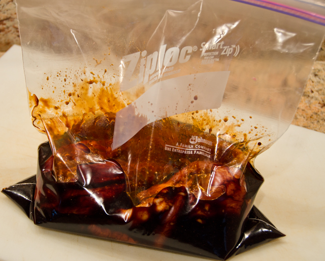 Pork pieces and marinade are added to a zip-loc bag.