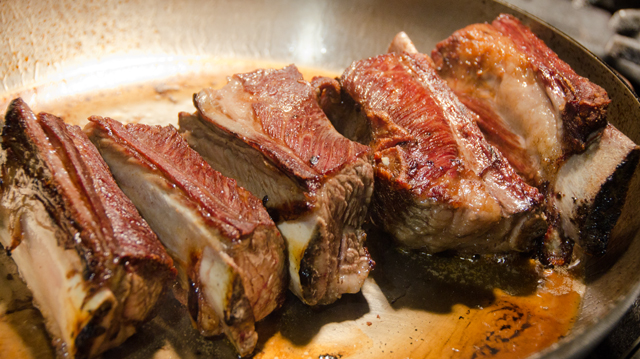 Brown the short ribs in a skillet or your slow cooker insert.