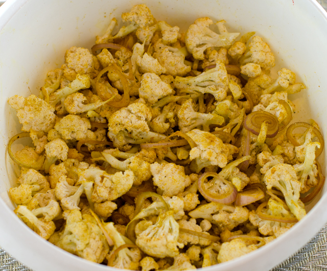 Cauliflower tossed with curry powder. The orange color comes from the turmeric.